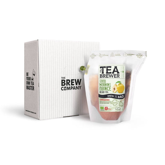 Good Morning Quince schwarzer Tee mit Quitte und Zitrus im Teabrewer-Beutel vor Verpackungskarton